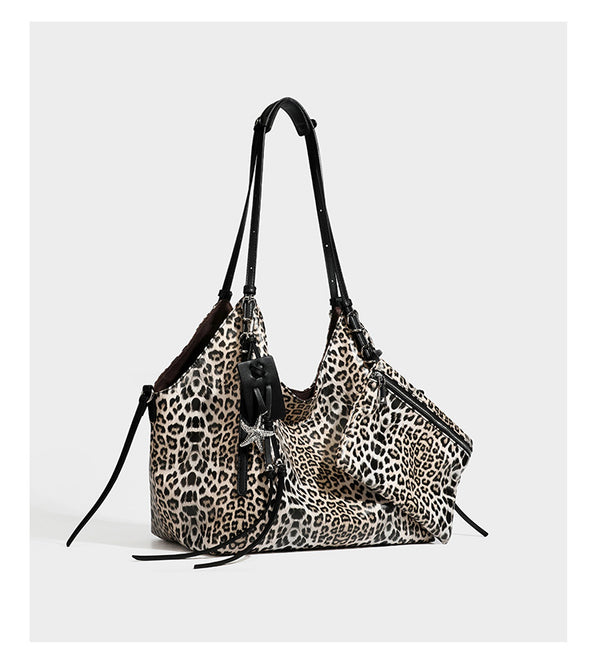 Large leopard print shoulder tote bag with glossy finish, long double straps, front zip pocket, silver-tone hardware, and