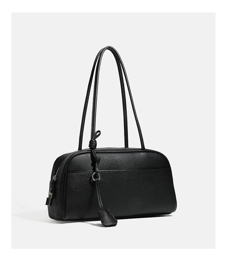 Structured rounded rectangular shoulder bag with pebbled leather-look finish, dual long handles, top zipper, front zip