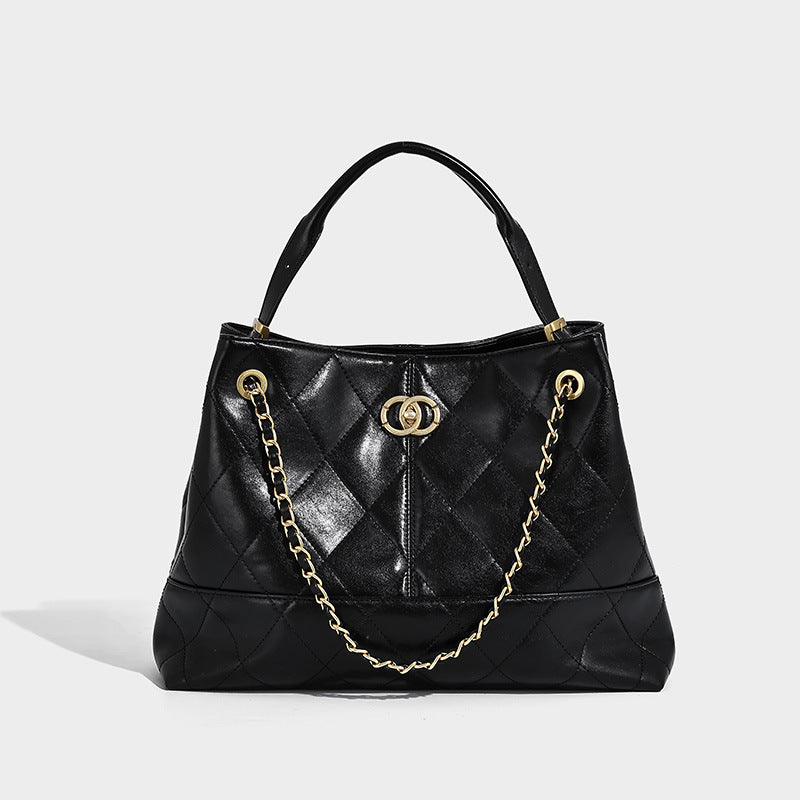 Gesteppte zweifarbige Schulter-Tote-Bag mit goldfarbener Kettenriemen und ineinandergreifendem Ringemblem im Colorblocking aus Apricot und Schwarz, Detailansicht
