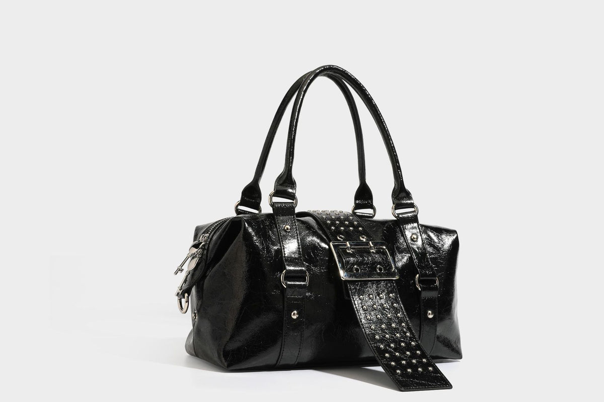 Glossy crinkled barrel handbag with silver stud buckle strap and detachable shoulder strap, detail view 26