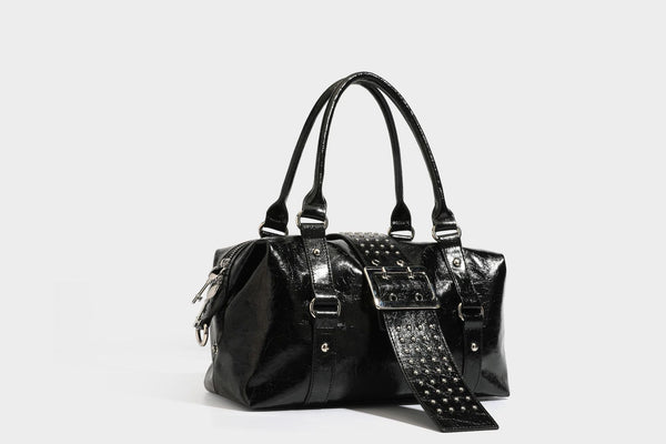 Glossy crinkled barrel handbag with silver stud buckle strap and detachable shoulder strap, detail view 26