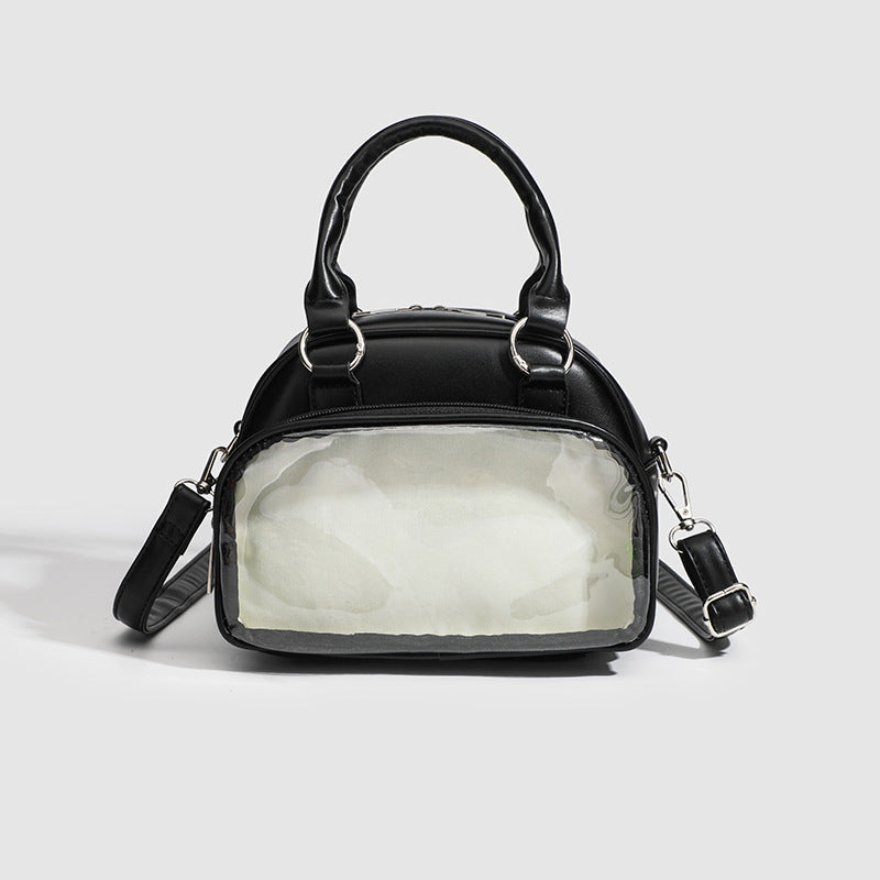Structured mini bowling barrel bag with clear front pocket, dual top handles, and detachable crossbody strap in glossy
