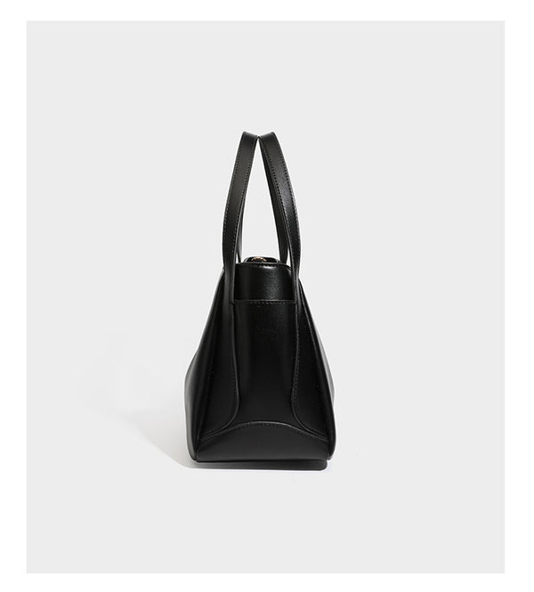 Structured glossy leather-look tote shoulder bag with dual top handles, detachable crossbody strap, side pockets, and, detail