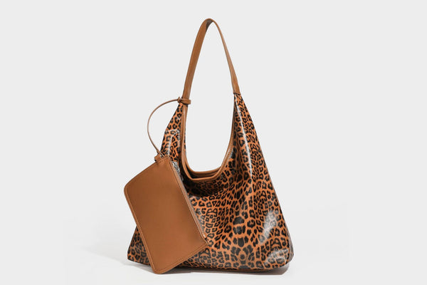 Glossy leopard-print slouchy shoulder bag with long strap and detachable tan zip pouch, detail view 21