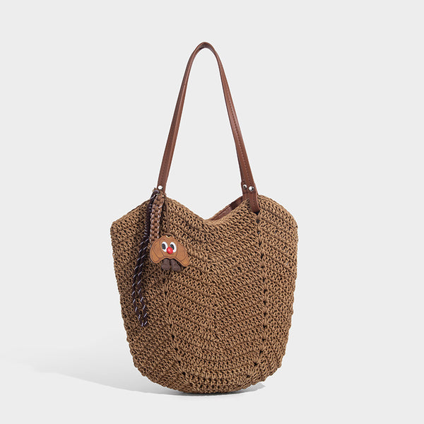 Woven crochet open-top shoulder tote bag with slim brown leather-look straps and braided charm accent, detail view 3