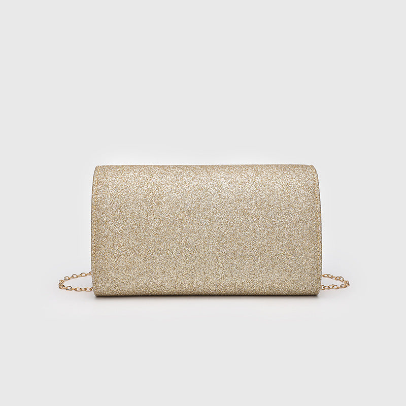 Structured glitter envelope clutch bag with gold-tone V-bar hardware and detachable chain strap, detail view 2