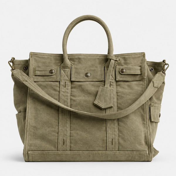 Large washed denim patchwork tote bag with snap-flap front pockets, rolled handles, and detachable shoulder strap, detail