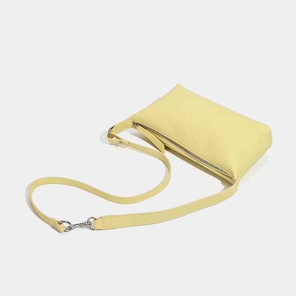 Small pebbled zip-top hobo bag with detachable adjustable strap and silver-tone hardware, detail view 4