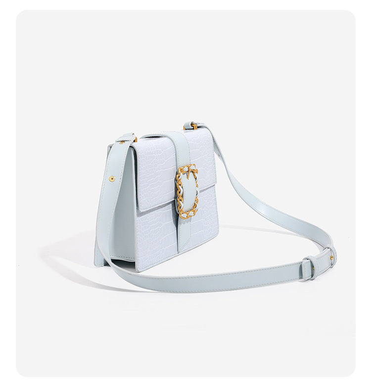 Structured crocodile-embossed flap shoulder bag with gold chain buckle hardware and adjustable strap, detail view 10