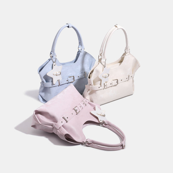 Large soft hobo shoulder bag with glossy textured finish, decorative belt buckle, star charm, and silver-tone hardware