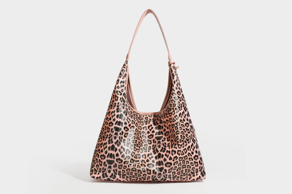 Glossy leopard-print slouchy shoulder bag with long strap and detachable tan zip pouch, detail view 36