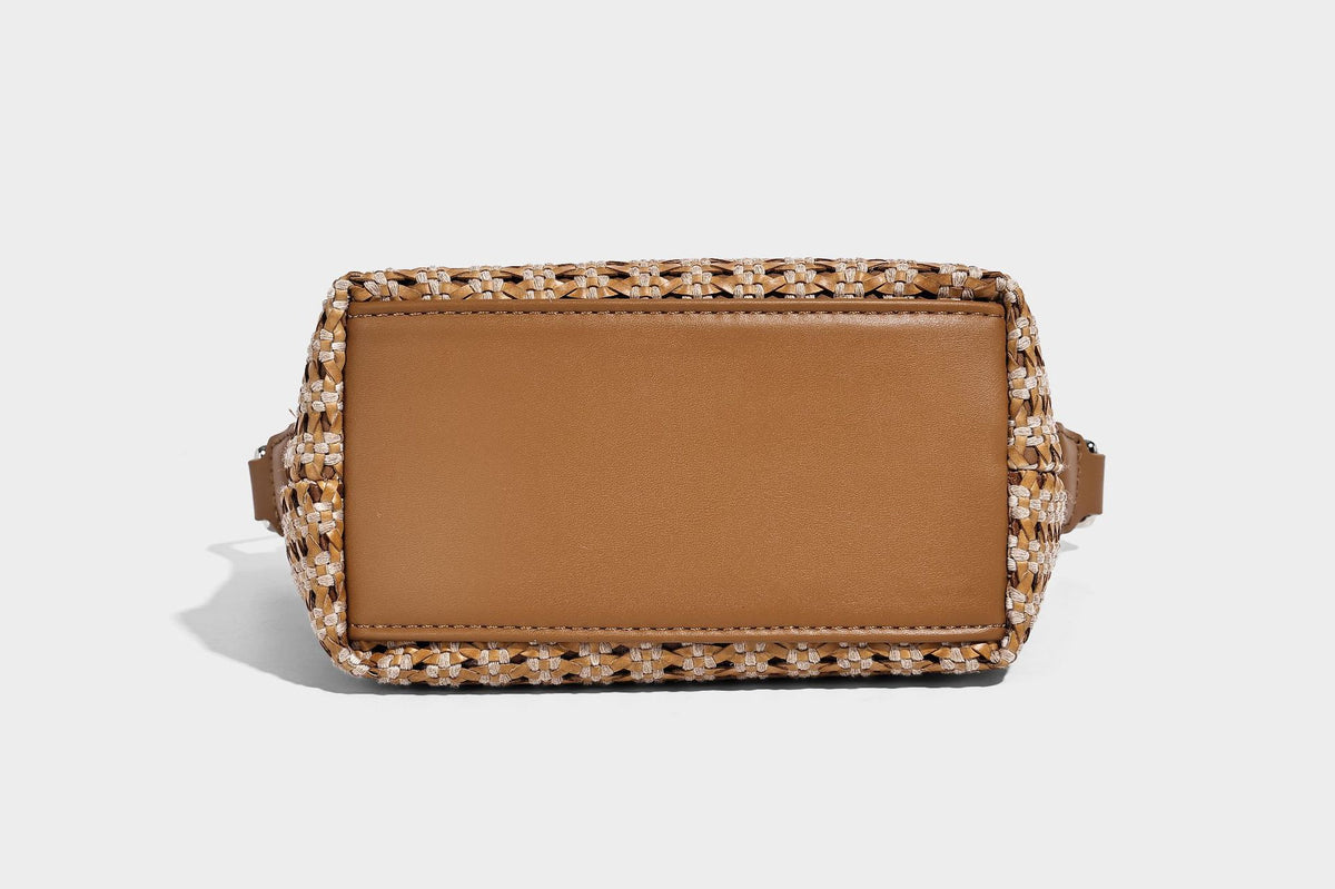 Woven crescent shoulder bag with leather-look knotted handle, zip top, attached mini pouch, and silver-tone hardware, detail