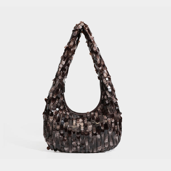Slouchy crescent hobo shoulder bag covered in overlapping reflective sequin discs with a single integrated strap and top-zip