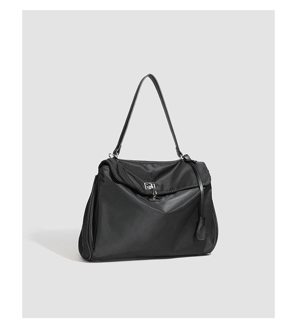 Structured black leather-look flap satchel bag with silver turn-lock hardware and top handle, detail view 27