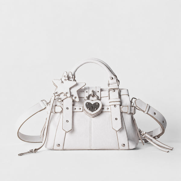 Structured satchel bag with heart-shaped padlock hardware, rivet studs, star charm, and twin top handles, detail view 7