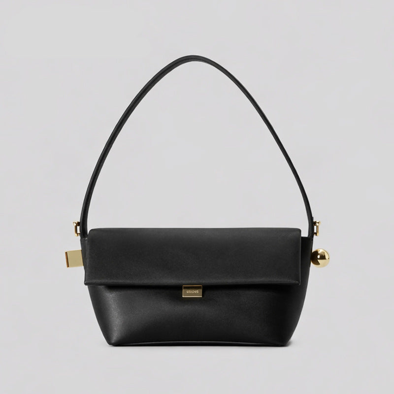 Structured trapezoid flap shoulder bag in red leather-look finish with gold-tone turn-lock clasp, sphere accent, and curved