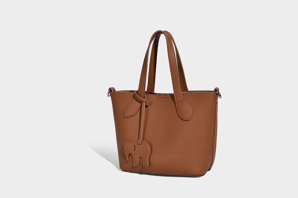 Compact pebbled bucket tote bag with elephant charm, twin top handles, and detachable crossbody strap, detail view 28