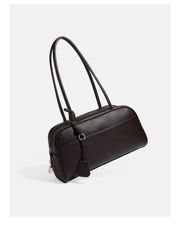 Structured rounded rectangular shoulder bag with pebbled leather-look finish, dual long handles, top zipper, front zip