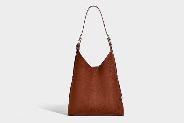 Large open-top hobo shoulder bag in tan leather-look finish with detachable zip pouch and adjustable buckle strap, detail