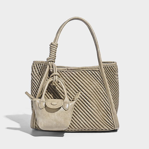 Large structured woven rope-texture tote bag with smooth leather-look trim, knotted dual top handles, detachable mini front