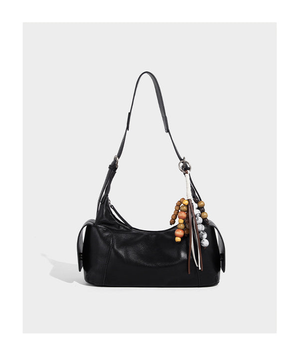 Soft pebbled leather-look hobo shoulder bag with zip top closure, side flap pockets, and silver-tone hardware, detail view 8