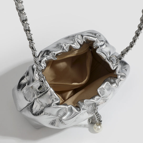 Small ruched drawstring bucket bag with twisted-link chain strap and pearl charm pull, detail view 4