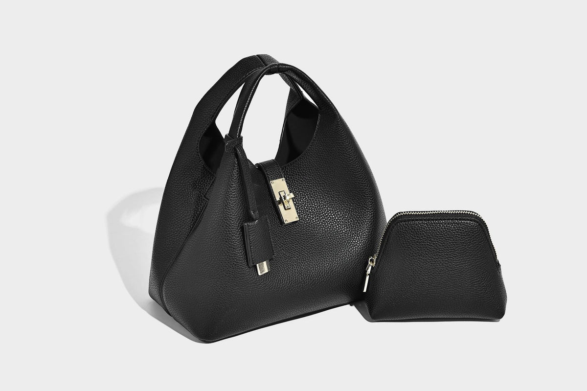 Structured pebbled-texture bucket bag with arched top handles, gold-tone turn-lock closure, and detachable shoulder strap