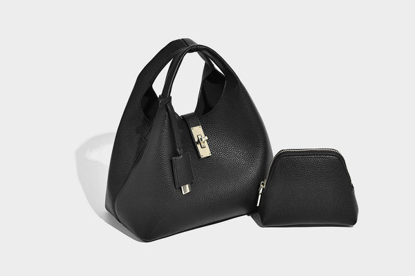 Structured pebbled-texture bucket bag with arched top handles, gold-tone turn-lock closure, and detachable shoulder strap