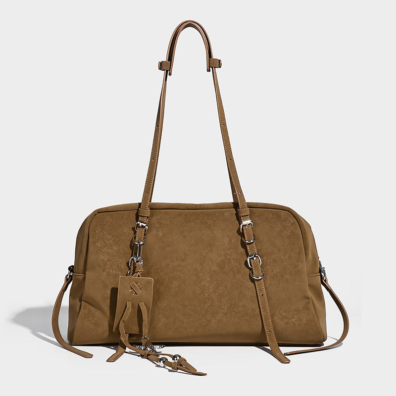 Structured rectangular matte suede-like shoulder bag with silver-tone hardware, zip closure, double top handles, and, detail