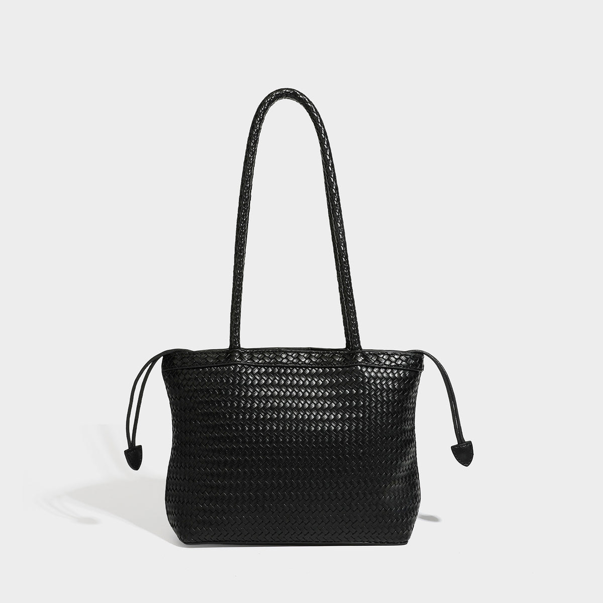 Structured woven leather-look tote bag in dark brown with long shoulder straps, side drawstring ties, and gold filigree