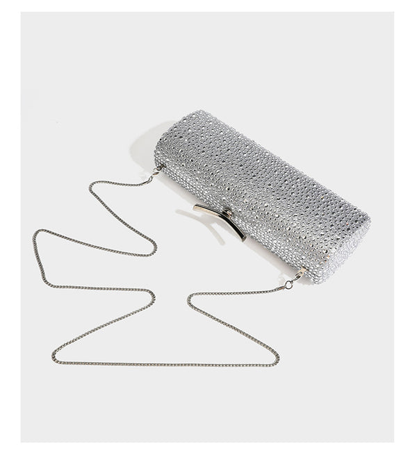 Structured rectangular hard-case clutch bag covered in all-over rhinestone crystal embellishment with curved kiss-lock top