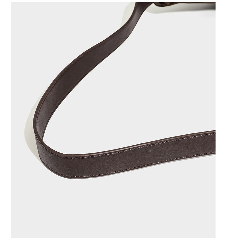 Slouchy hobo shoulder bag in matte croc-embossed leather-look finish with top zip closure and long adjustable strap, detail