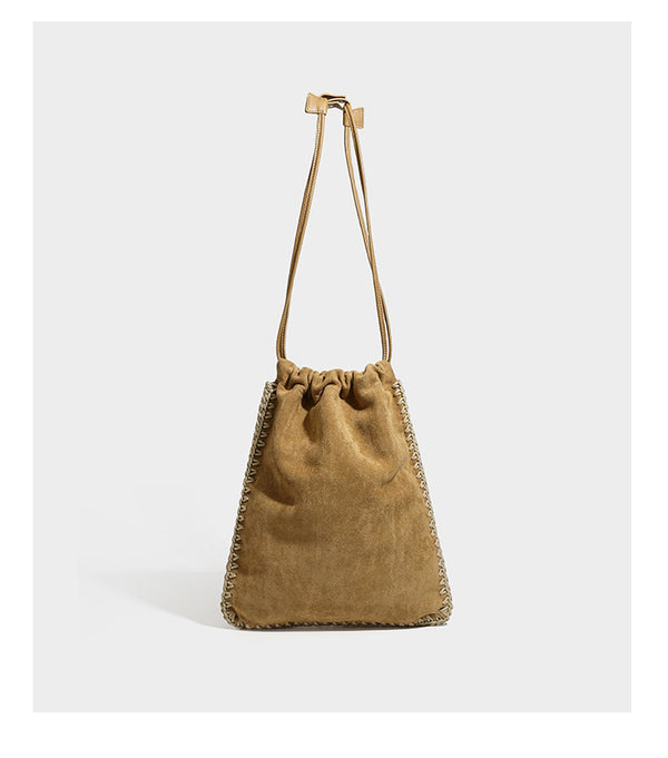 Matte suede-look drawstring bucket bag with cream braided woven edge trim and slim adjustable leather-look shoulder strap