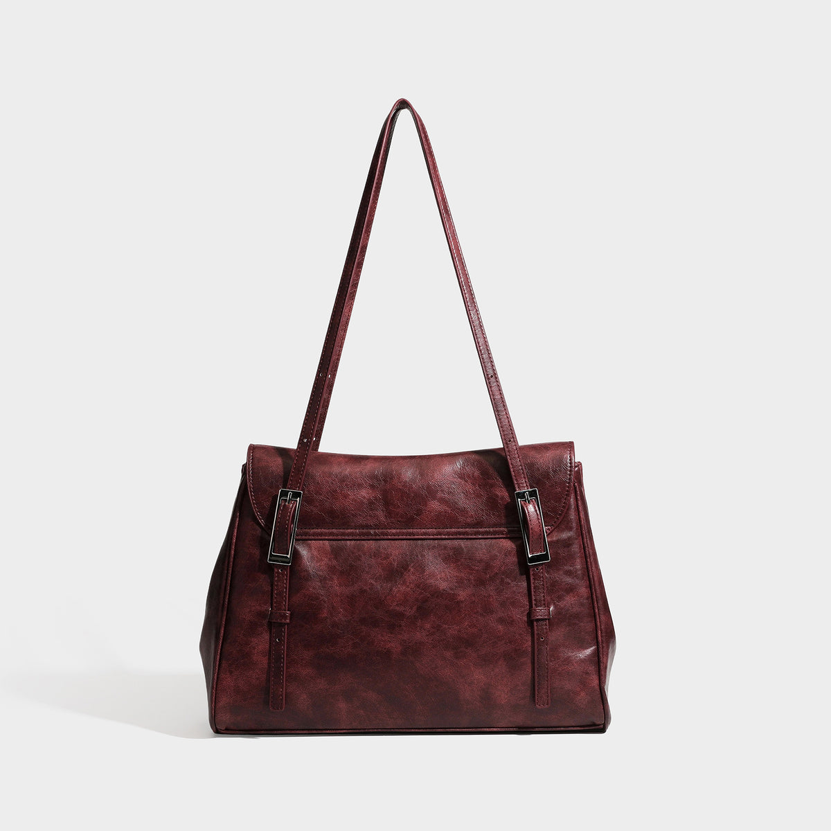 Structured flap-top shoulder tote bag in distressed leather-look finish with silver-tone buckle hardware and double shoulder