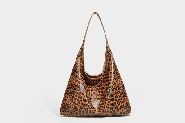 Glossy leopard-print slouchy shoulder bag with long strap and detachable tan zip pouch, detail view 23