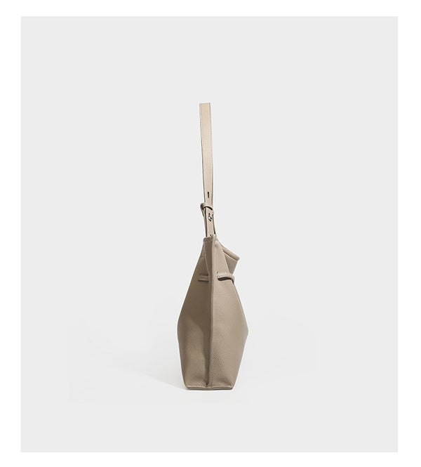 Large structured tote bag in pebbled leather-look finish with silver-tone twist-knot front detail and adjustable shoulder