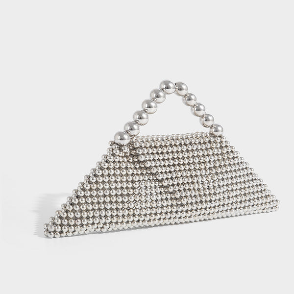 Small structured triangle clutch bag covered in glossy pearl beads with an arched pearl top handle and silver snap closure