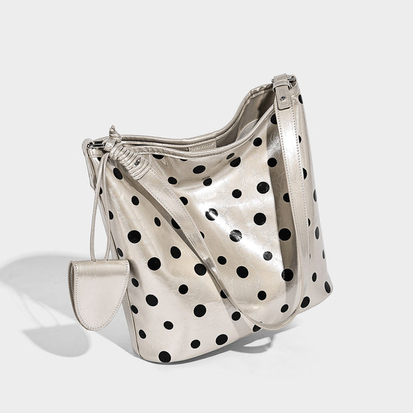 Glossy crinkled polka-dot bucket hobo bag with adjustable crossbody strap and side pouch, detail view 3