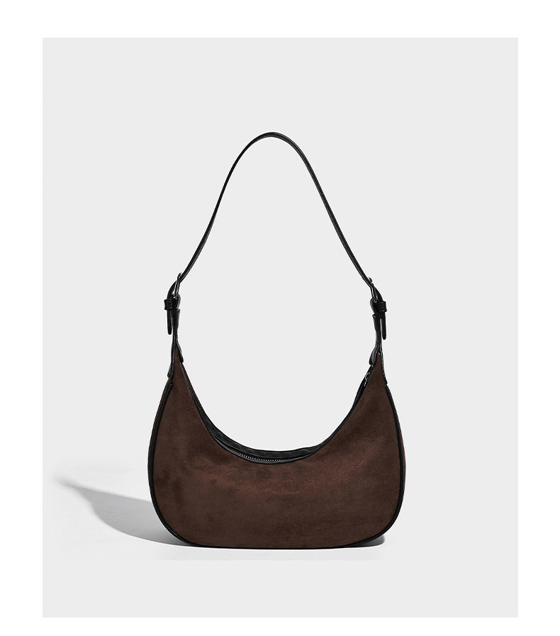 Crescent hobo shoulder bag in matte suede-look finish with black trim and adjustable strap, detail view 13
