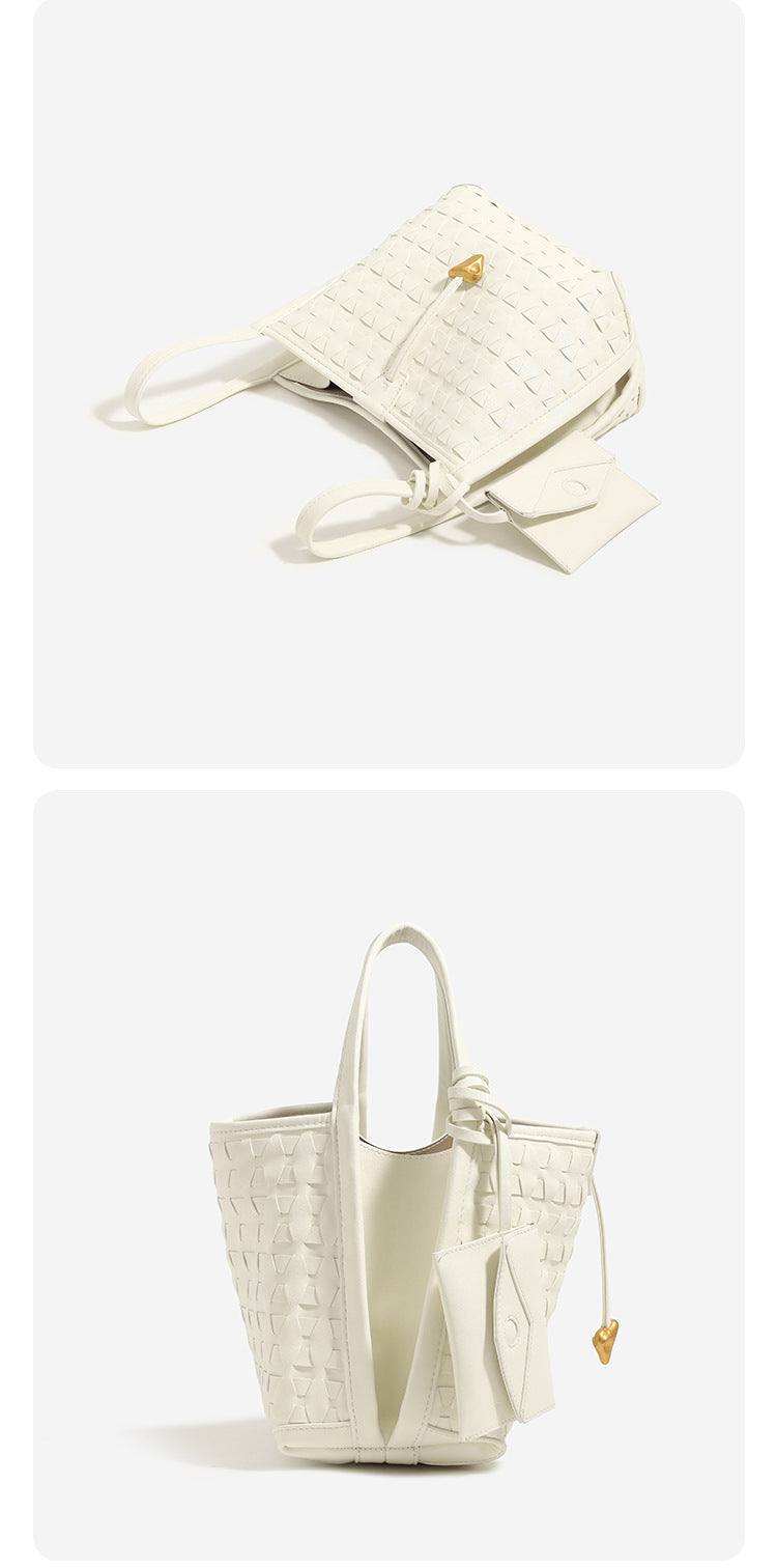 Woven embossed leather-look bucket bag with triangular texture pattern, gold-tone hardware, and attached mini snap pouch