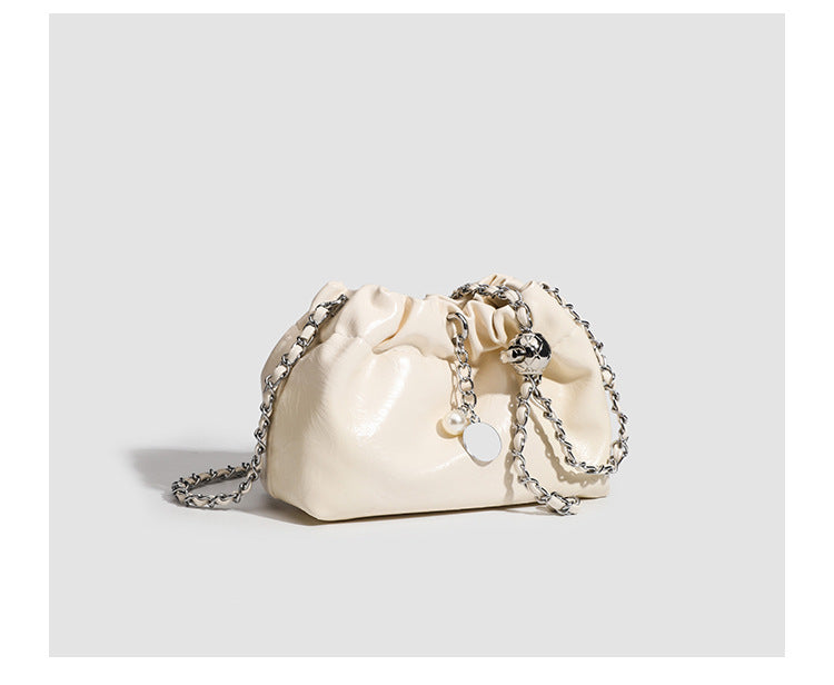 Small ruched drawstring bucket bag with twisted-link chain strap and pearl charm pull, detail view 12