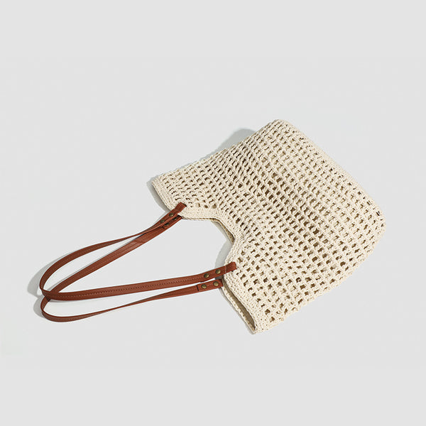 Open-knit woven tote bag with leather-look shoulder straps and brass-tone hardware in off-white, detail view 4