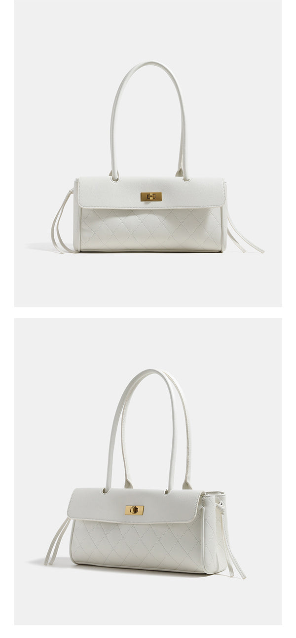 Structured quilted diamond-stitch baguette handbag with gold-tone turn-lock closure and dual top handles, detail view 9