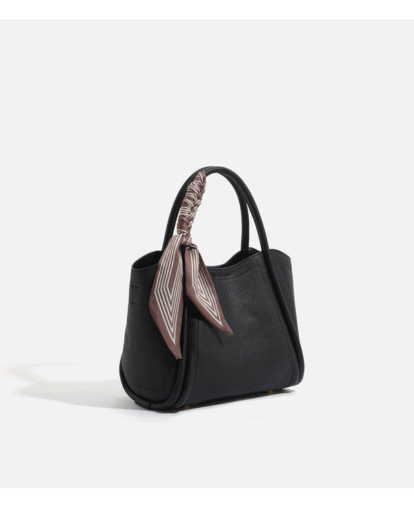 Pebbled leather-look bucket tote bag with scarf-wrapped top handle and gold-tone hardware, detail view 19