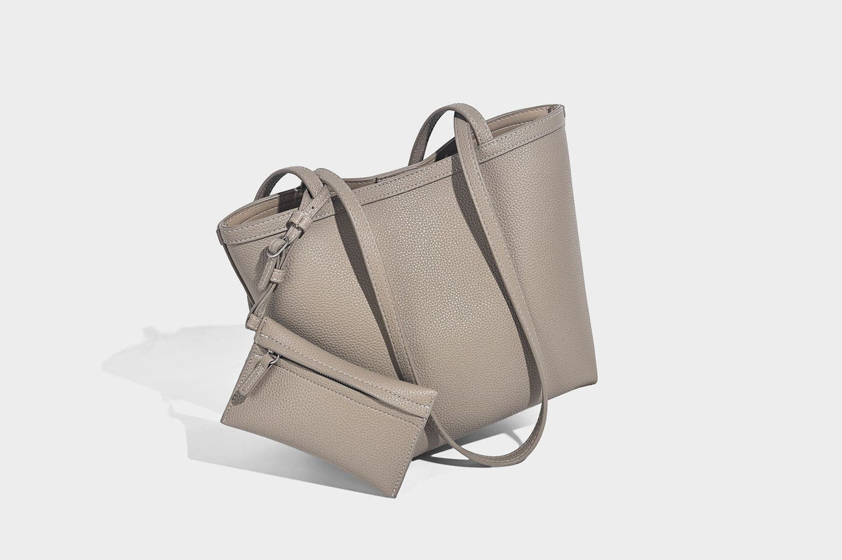 Structured pebbled leather-look tote bag in taupe with long shoulder strap, detachable zip pouch, and pink tulip flower