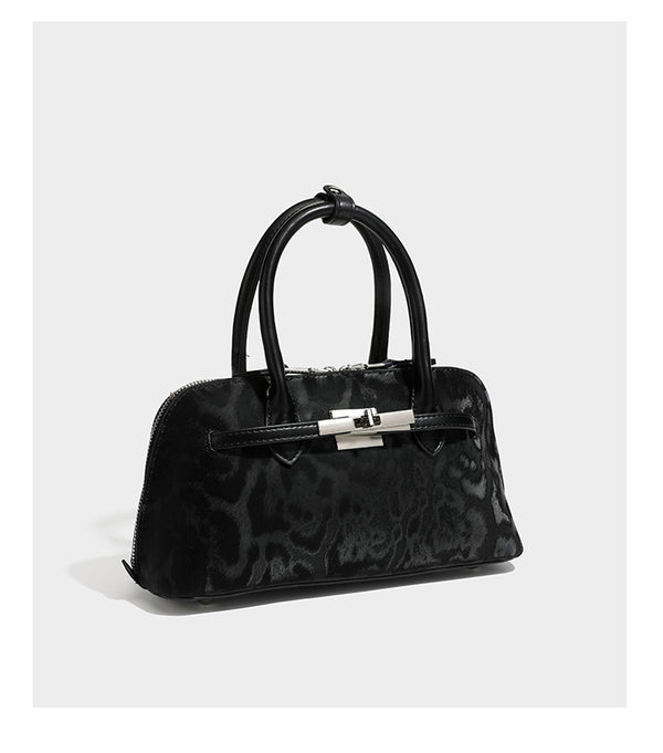 Strukturierte Henkeltasche mit tonal abgestimmtem Leopardenprint, Besatz in Lederoptik, gerollten Henkeln, vorderem Drehverschluss und