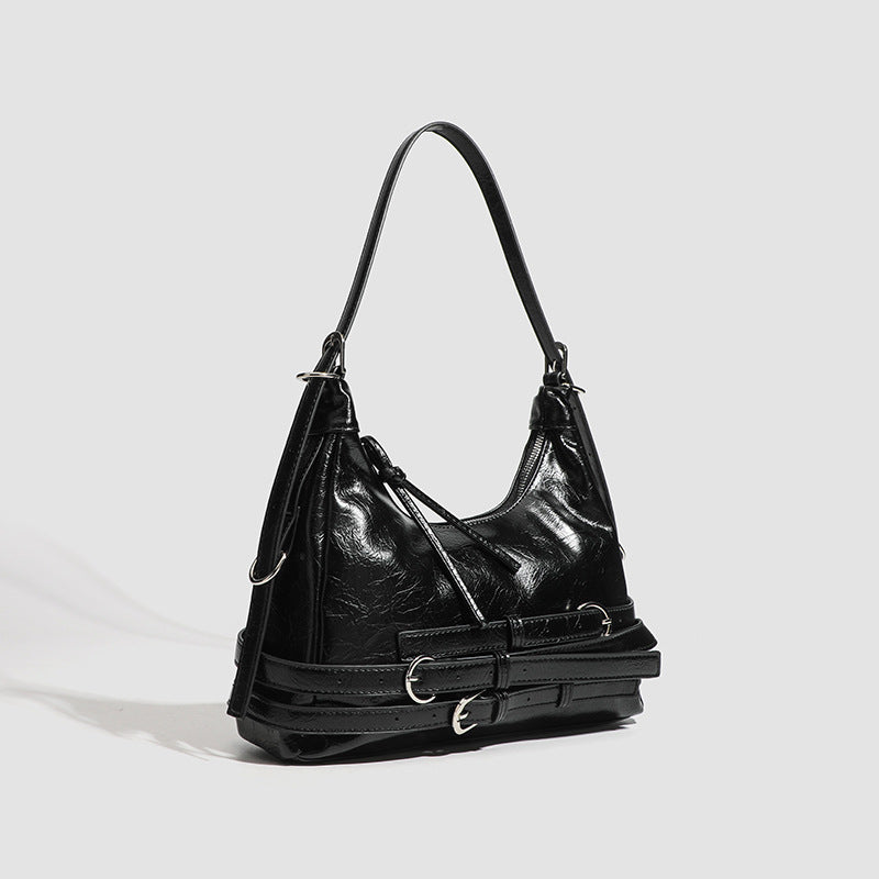 Slouchy hobo shoulder bag in glossy crinkled leather-look finish with silver-tone buckle hardware and slim adjustable strap