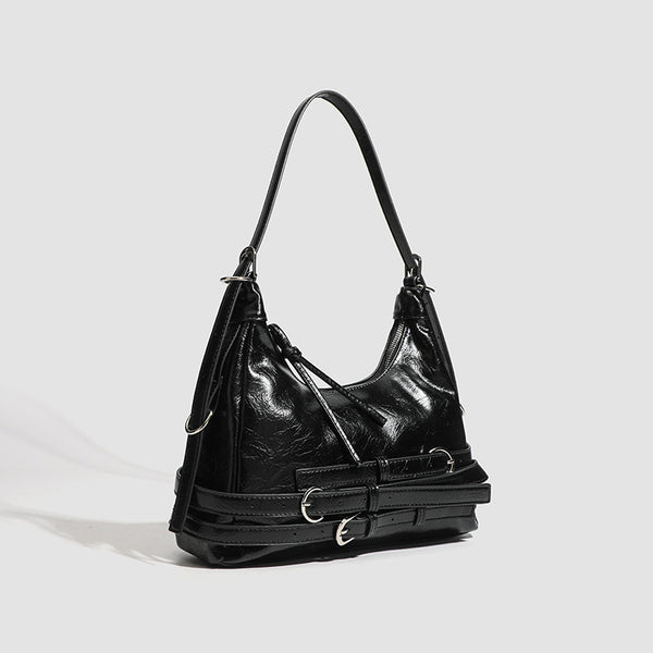Slouchy hobo shoulder bag in glossy crinkled leather-look finish with silver-tone buckle hardware and slim adjustable strap