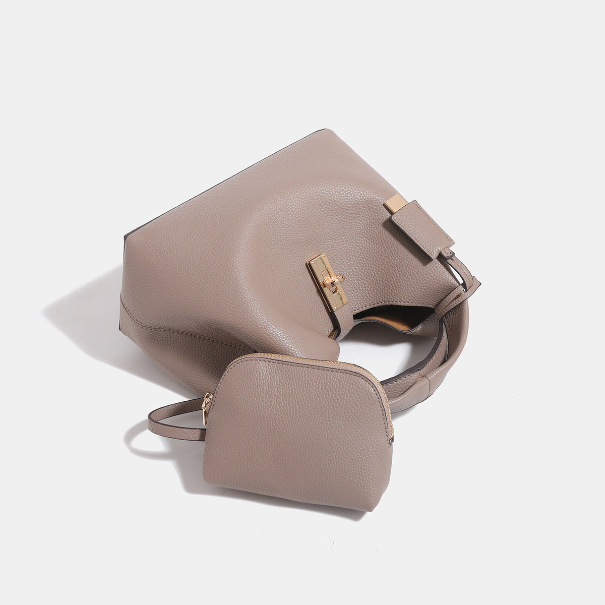 Structured pebbled leather-look bucket tote with gold-tone turn-lock hardware and looped top handle, detail view 4