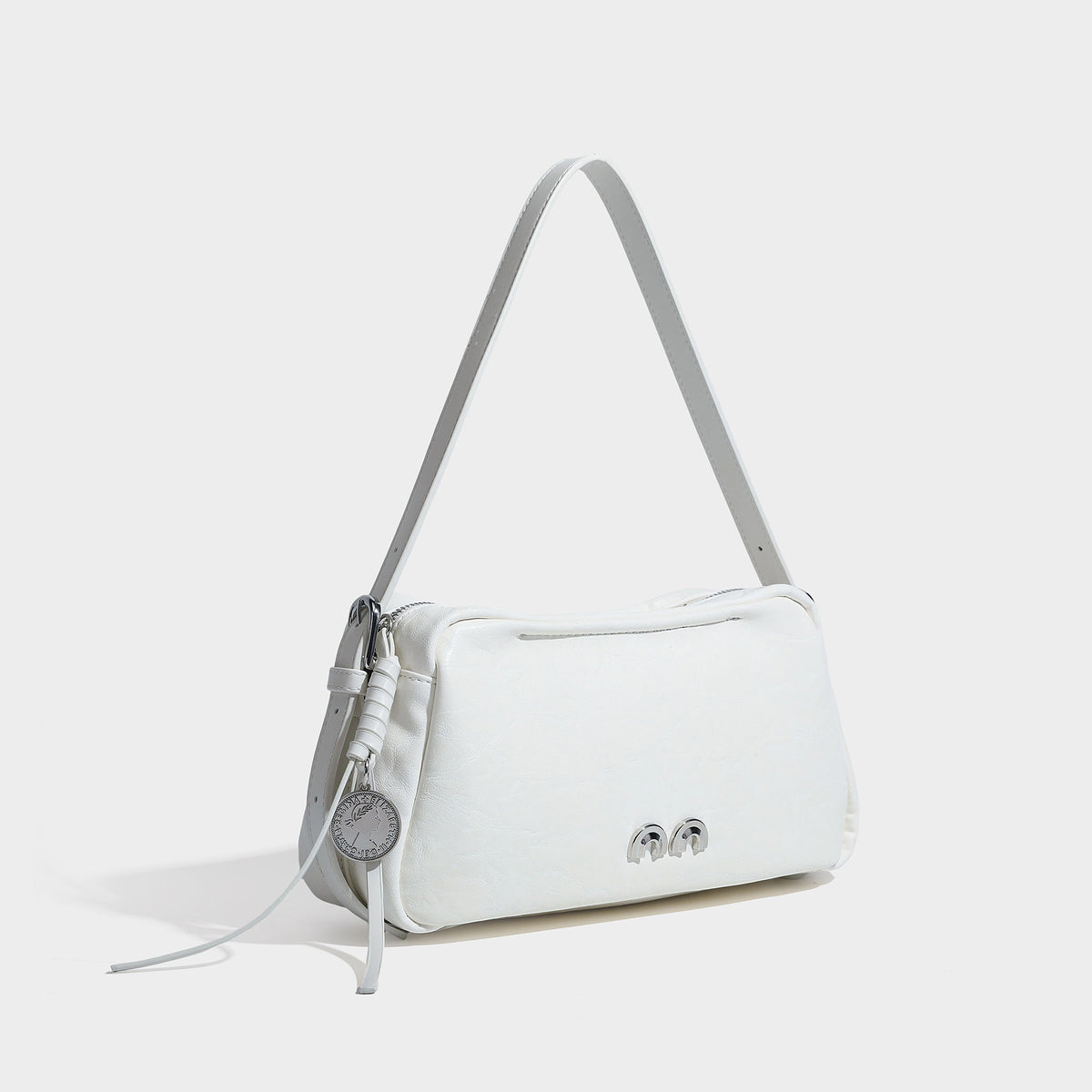 Compact black crinkled leather-look baguette shoulder bag with gold-tone arch hardware and adjustable strap, detail view 3